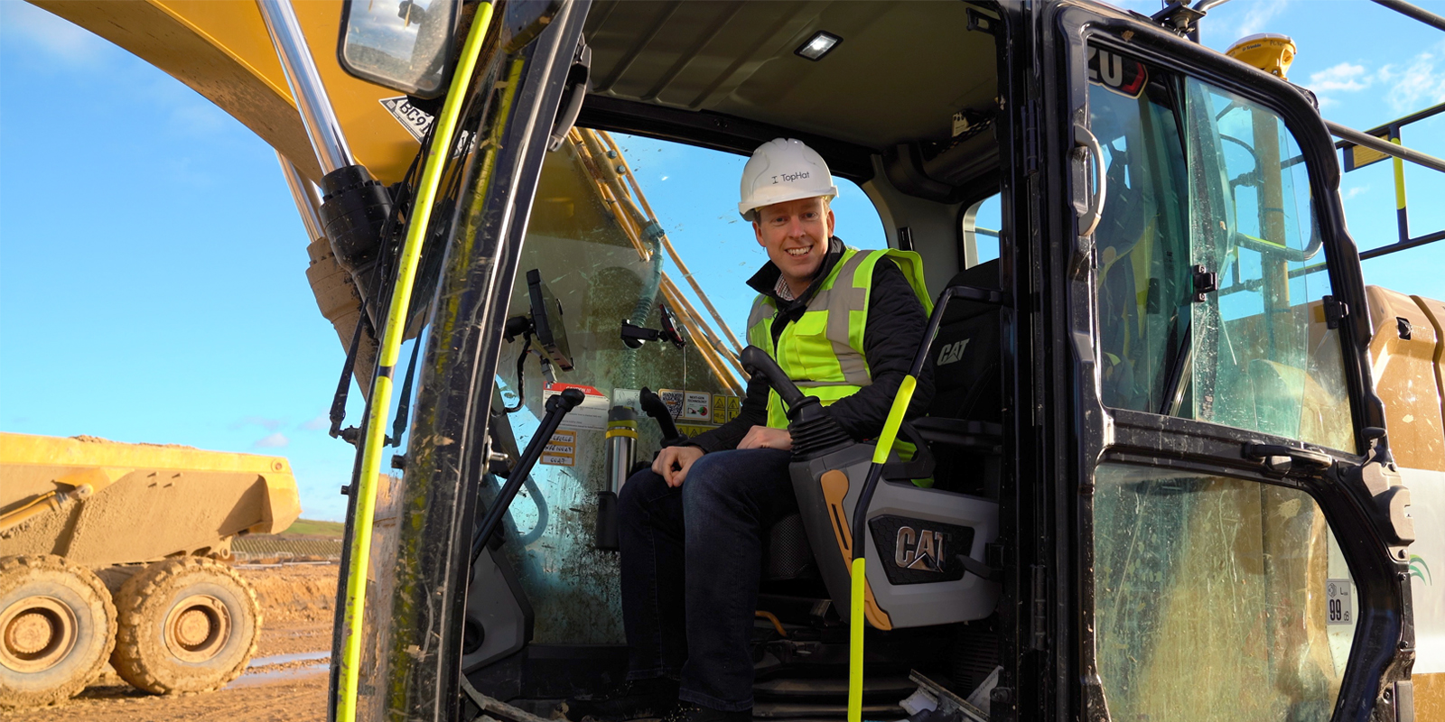 Corby MP Tom sitting in digger
